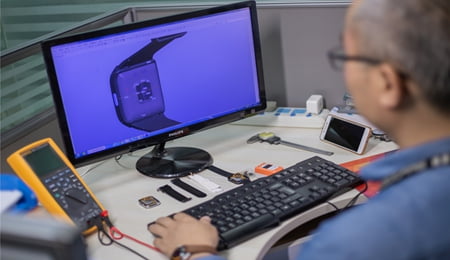 R&D laboratory with engineers working on new designs